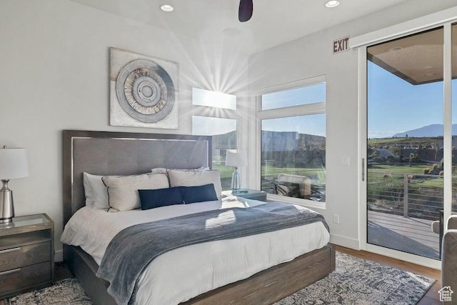 1478 W Torrey Rd, Hurricane, UT 84737 - bedroom featuring a mountain view, recessed lighting, wood finished floors, baseboards, and access to exterior