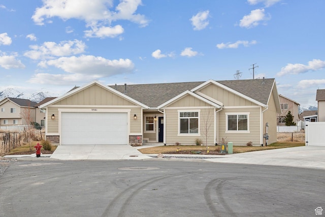 3361 W Sophie Ln, West Haven, UT 84401 - view of front of property with driveway, fence, board and batten siding, an attached garage, and a shingled roof