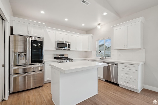 3361 W Sophie Ln, West Haven, UT 84401 - kitchen featuring white cabinets, light wood finished floors, visible vents, and appliances with stainless steel finishes