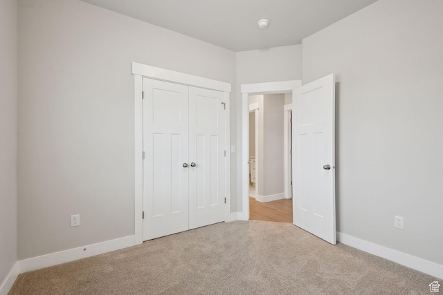 3361 W Sophie Ln, West Haven, UT 84401 - unfurnished bedroom with a closet, carpet flooring, and baseboards