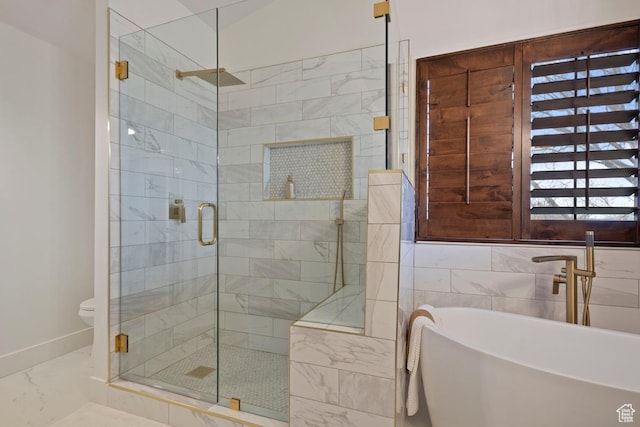 9971 S Dunsinane Dr W, South Jordan, UT 84009 - full bath featuring a freestanding tub, toilet, baseboards, marble finish floor, and a shower stall