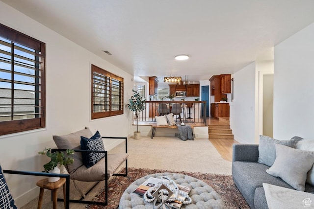 9971 S Dunsinane Dr W, South Jordan, UT 84009 - living room featuring visible vents and baseboards