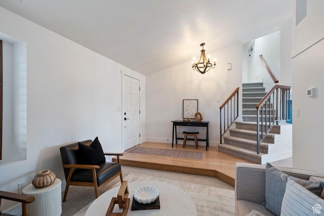 9971 S Dunsinane Dr W, South Jordan, UT 84009 - living area featuring baseboards, wood finished floors, stairs, vaulted ceiling, and a chandelier