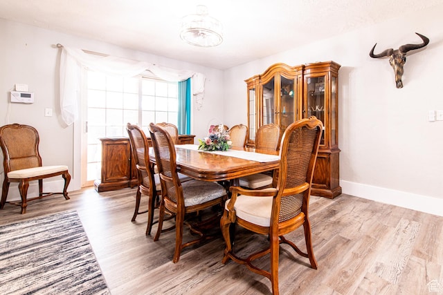 1027 S 920 W, Hurricane, UT 84737 - dining area featuring light wood-style floors and baseboards