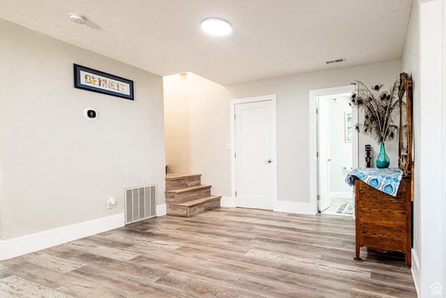 1027 S 920 W, Hurricane, UT 84737 - interior space featuring light wood finished floors, baseboards, stairs, and visible vents