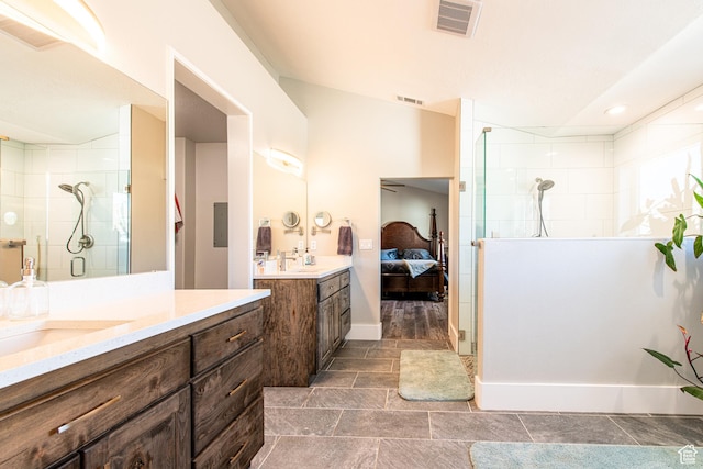 1027 S 920 W, Hurricane, UT 84737 - ensuite bathroom featuring tiled shower, vanity, visible vents, and connected bathroom