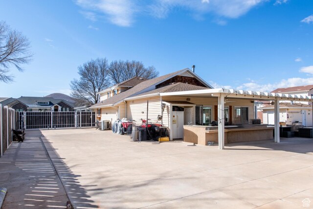 1027 S 920 W, Hurricane, UT 84737 - back of house featuring a patio area, fence, outdoor dry bar, and a pergola