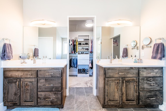 1027 S 920 W, Hurricane, UT 84737 - bathroom with a spacious closet, two vanities, and a sink