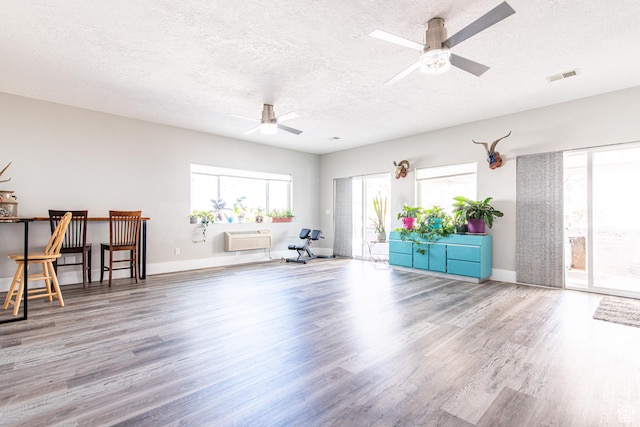 1027 S 920 W, Hurricane, UT 84737 - unfurnished room with baseboards, visible vents, a ceiling fan, wood finished floors, and a textured ceiling