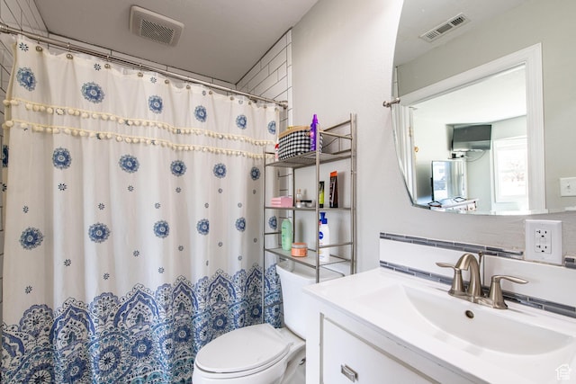 1027 S 920 W, Hurricane, UT 84737 - full bathroom with tasteful backsplash, visible vents, vanity, and toilet
