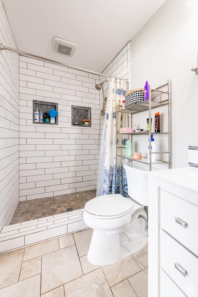 1027 S 920 W, Hurricane, UT 84737 - bathroom with visible vents, vanity, a shower stall, and toilet