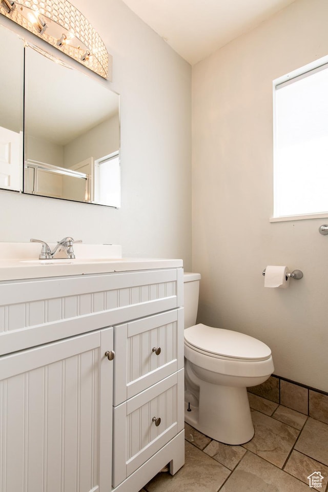 1027 S 920 W, Hurricane, UT 84737 - bathroom with walk in shower, tile patterned flooring, vanity, and toilet