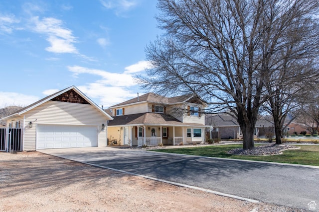 1027 S 920 W, Hurricane, UT 84737 - view of front of property with driveway, covered porch, a garage, and a front lawn