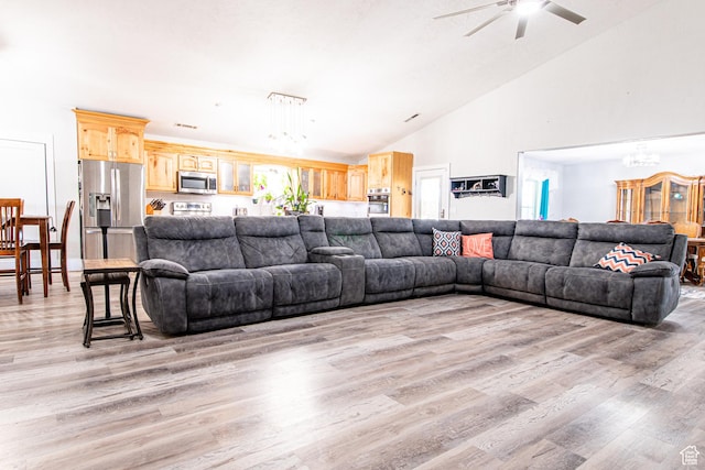 1027 S 920 W, Hurricane, UT 84737 - living room with light wood-style floors, high vaulted ceiling, and ceiling fan with notable chandelier