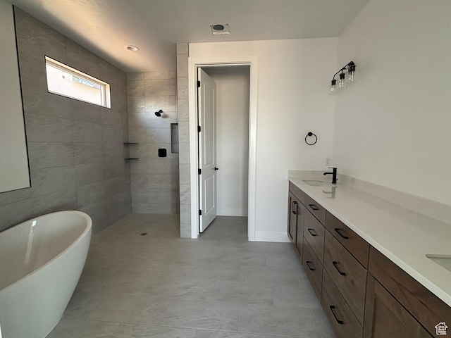 579 S 1800 W, Hurricane, UT 84737 - full bathroom with a freestanding bath, double vanity, a sink, baseboards, and walk in shower