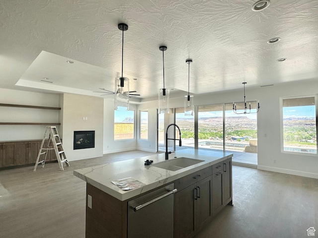 579 S 1800 W, Hurricane, UT 84737 - kitchen featuring dishwasher, a healthy amount of sunlight, a sink, baseboards, and light wood-style flooring