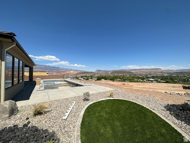 579 S 1800 W, Hurricane, UT 84737 - view of yard featuring a fenced in pool, a mountain view, and a patio