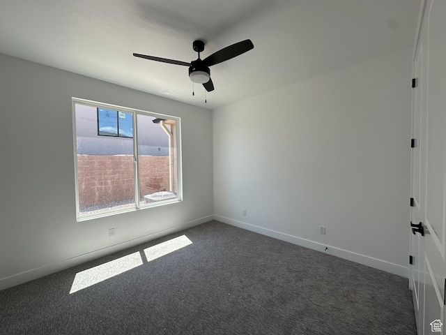 579 S 1800 W, Hurricane, UT 84737 - empty room featuring dark carpet, baseboards, and a ceiling fan