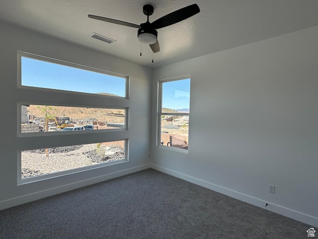 579 S 1800 W, Hurricane, UT 84737 - spare room featuring baseboards, visible vents, dark carpet, and ceiling fan
