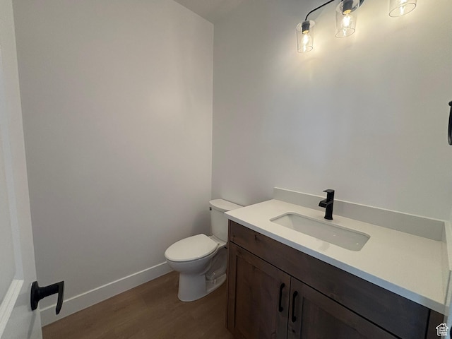 579 S 1800 W, Hurricane, UT 84737 - half bath with baseboards, wood finished floors, toilet, and vanity