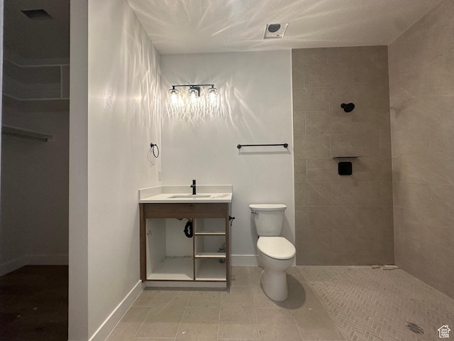 591 S 1800 W, Hurricane, UT 84737 - full bath featuring tiled shower, toilet, baseboards, tile patterned flooring, and vanity