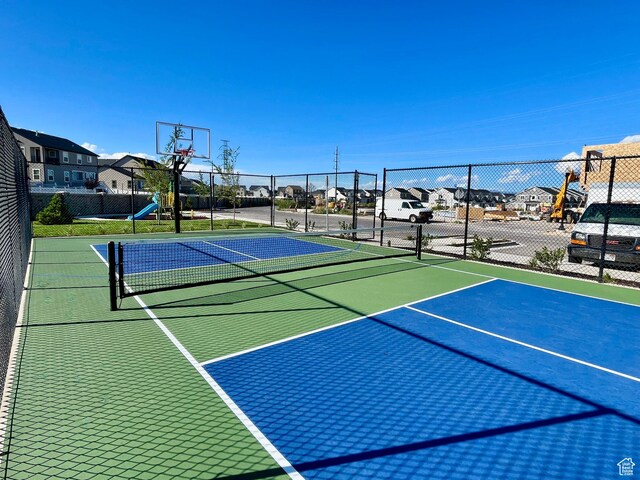 12941 S Corona Arch Ct Unit 571, Riverton, UT 84096 - view of basketball court with a residential view, fence, and community basketball court