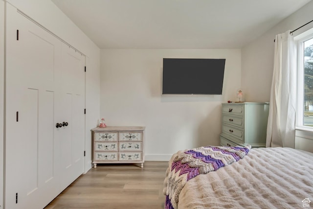 bedroom featuring light wood finished floors