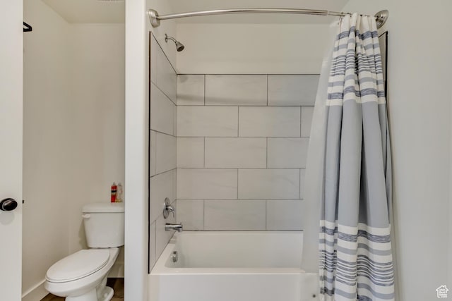 full bathroom with toilet and shower / tub combo