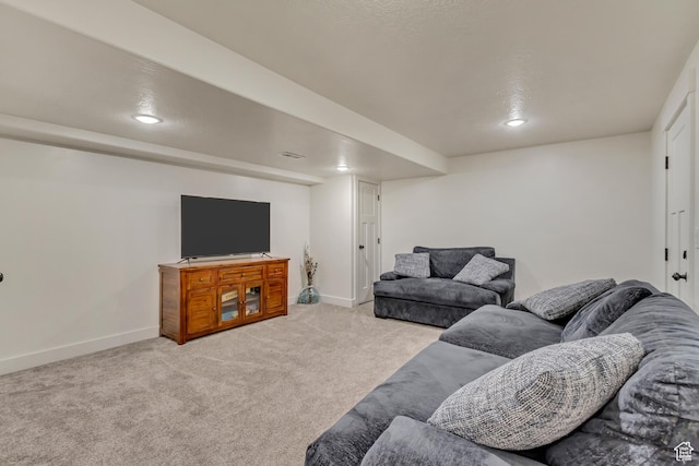 living area with recessed lighting, light carpet, visible vents, and baseboards