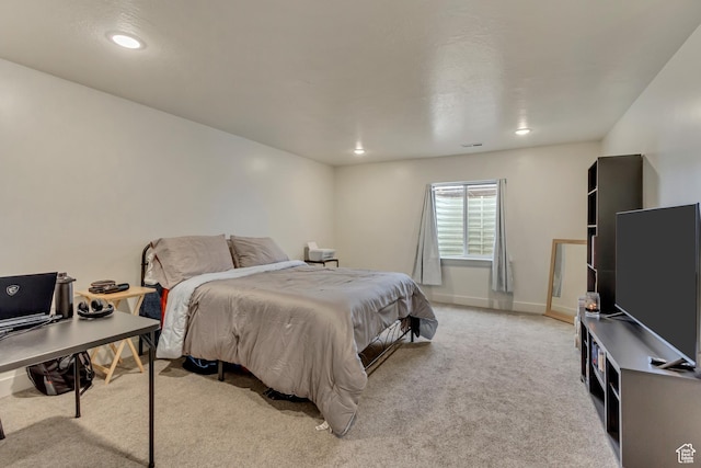 bedroom with light carpet, baseboards, and recessed lighting