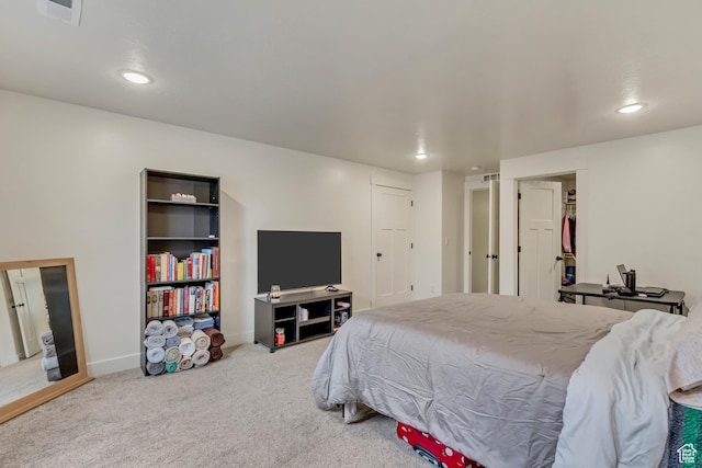 bedroom featuring carpet floors, recessed lighting, visible vents, and baseboards