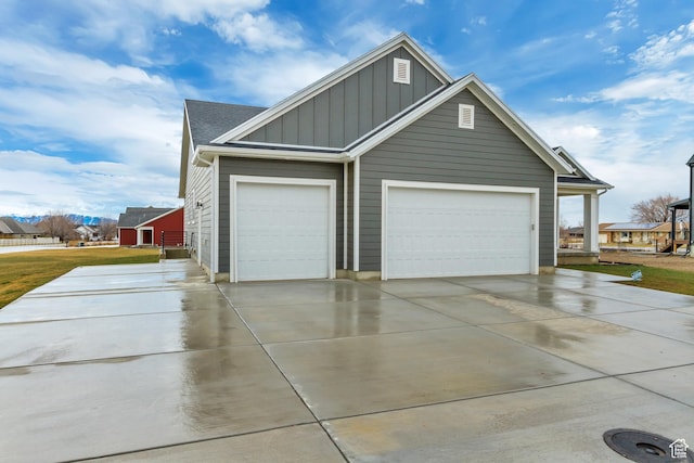 garage featuring concrete driveway