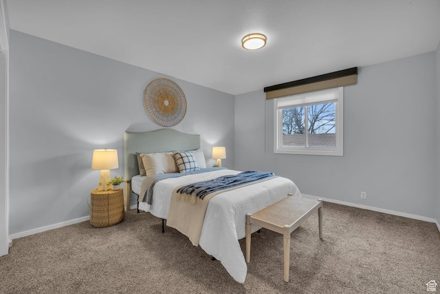 carpeted bedroom featuring baseboards