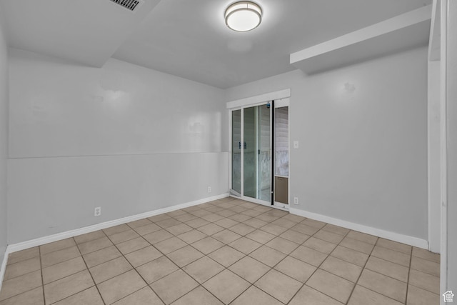 spare room featuring baseboards