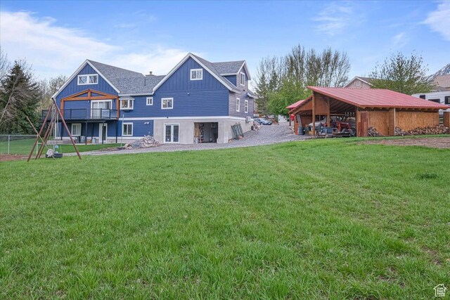 550 N 200 E, Wellsville, UT 84339 - rear view of house featuring board and batten siding and a lawn