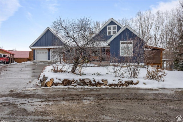 550 N 200 E, Wellsville, UT 84339 - view of front of property featuring a garage, board and batten siding, and driveway