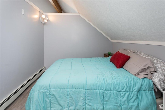 550 N 200 E, Wellsville, UT 84339 - bedroom with a textured ceiling, wood finished floors, lofted ceiling, and a baseboard radiator