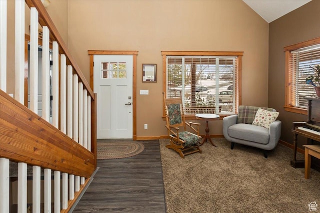 550 N 200 E, Wellsville, UT 84339 - foyer with dark wood-type flooring, high vaulted ceiling, and baseboards