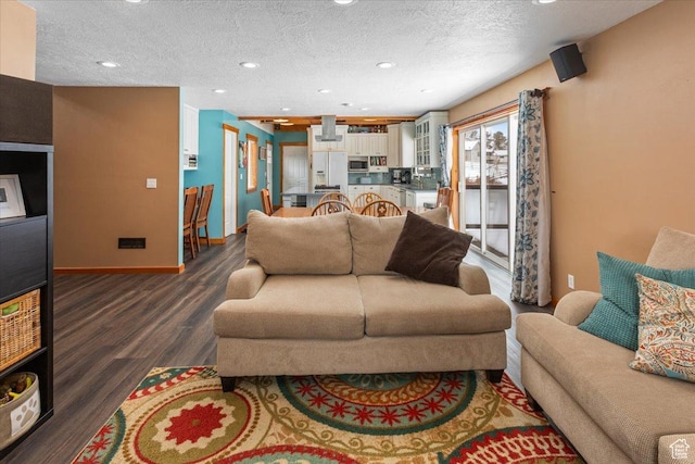 550 N 200 E, Wellsville, UT 84339 - living room with dark wood-style floors, recessed lighting, a textured ceiling, and baseboards