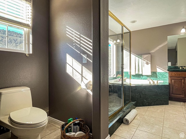 full bathroom with tile patterned floors, toilet, vanity, a shower stall, and a bath
