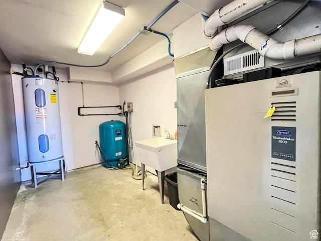 utilities with water heater and a sink