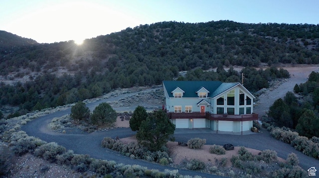 birds eye view of property with a view of trees