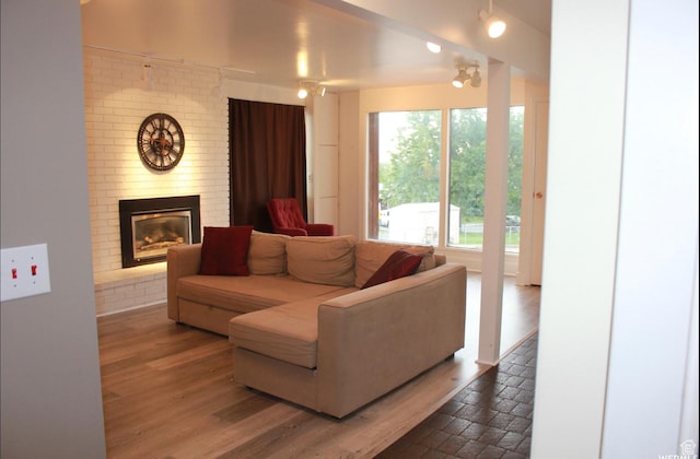 134 E 175 S, North Salt Lake, UT 84054 - living area featuring a brick fireplace and wood finished floors