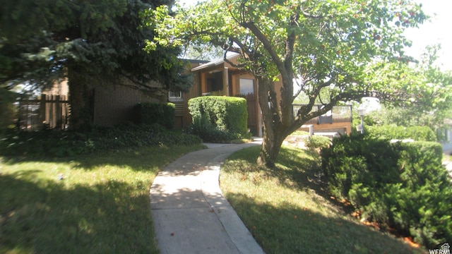 134 E 175 S, North Salt Lake, UT 84054 - view of front of home with fence, a front lawn, and brick siding