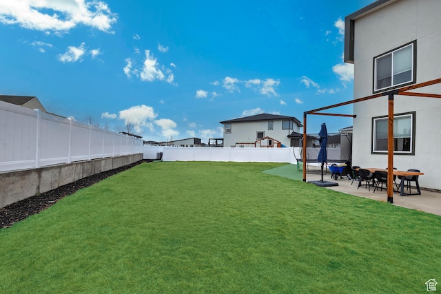 view of yard featuring a patio area and a fenced backyard