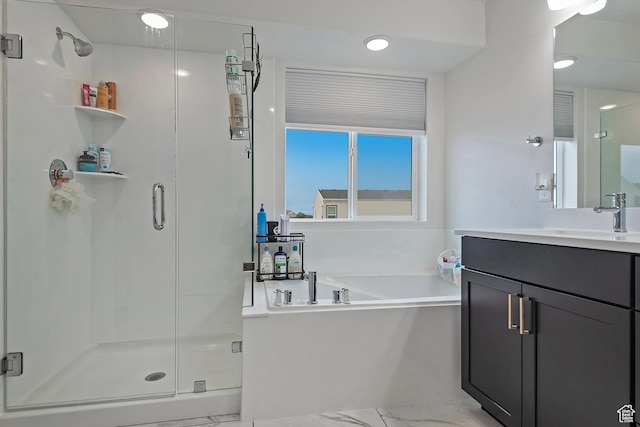 bathroom featuring marble finish floor, a shower stall, vanity, and a bath