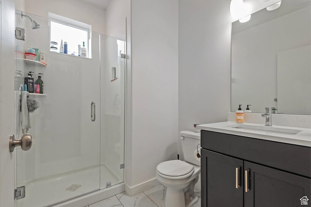 bathroom featuring marble finish floor, a stall shower, vanity, and toilet