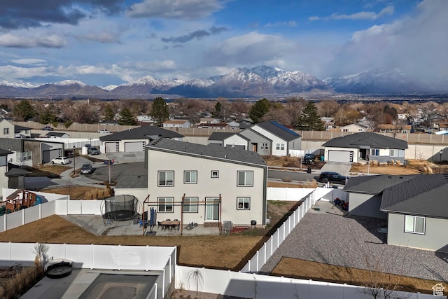 exterior space with a mountain view and a residential view