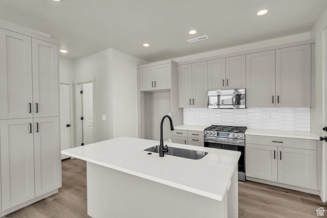 560 W Aqua Cv Unit 506, St George, UT 84790 - kitchen featuring tasteful backsplash, light wood-style flooring, stainless steel appliances, and a sink