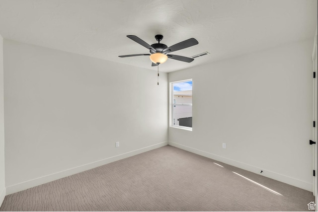560 W Aqua Cv Unit 506, St George, UT 84790 - unfurnished room with a ceiling fan, light colored carpet, visible vents, and baseboards